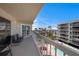 Overhead shot of a balcony, with chairs and glimpses of the nearby pool at 19925 Gulf Blvd # 407, Indian Shores, FL 33785
