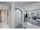 Bright hallway leading to the living room with stylish coastal accents at 19925 Gulf Blvd # 407, Indian Shores, FL 33785