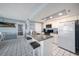 Well-equipped kitchen with granite countertops and modern appliances at 19925 Gulf Blvd # 407, Indian Shores, FL 33785