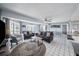 Open living room area with tile floors and lots of natural light at 19925 Gulf Blvd # 407, Indian Shores, FL 33785