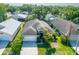 Aerial view of a single-Gathering home featuring mature landscaping, and a two-car garage at 2024 Glen Forge St, Brandon, FL 33511
