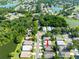Neighborhood aerial view showcasing tree-lined streets and well-maintained homes near a tranquil lake at 2024 Glen Forge St, Brandon, FL 33511