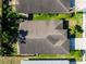 Aerial view of the roof of a single-Gathering home featuring mature landscaping, and a two-car garage at 2024 Glen Forge St, Brandon, FL 33511