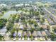 Scenic aerial view of a neighborhood with mature trees and serene lakes providing a peaceful environment at 2024 Glen Forge St, Brandon, FL 33511