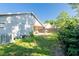 View of the house's backyard with a patio, lawn, and a fenced perimeter at 2024 Glen Forge St, Brandon, FL 33511