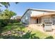 Spacious backyard showcasing a patio, lawn, and privacy fence, perfect for outdoor enjoyment at 2024 Glen Forge St, Brandon, FL 33511