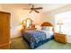 Bedroom featuring a wooden bed frame, matching dresser, and cozy lamps for a warm ambiance at 2024 Glen Forge St, Brandon, FL 33511