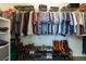 Walk-in closet showcasing organized shelving with clothing, shoes, and accessories neatly arranged at 2024 Glen Forge St, Brandon, FL 33511