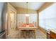 Cozy dining area with a table and chairs beneath a pendant light fixture, adjacent to the kitchen at 2024 Glen Forge St, Brandon, FL 33511