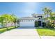 Charming single-Gathering home featuring a well-maintained lawn, mature landscaping, and a two-car garage at 2024 Glen Forge St, Brandon, FL 33511