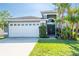 Charming single-Gathering home featuring a well-maintained lawn, mature landscaping, and a two-car garage at 2024 Glen Forge St, Brandon, FL 33511