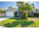 Charming single-Gathering home featuring a well-maintained lawn, mature landscaping, and a two-car garage at 2024 Glen Forge St, Brandon, FL 33511