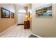 Foyer with tiled floor, traditional artwork, and double front doors at 2024 Glen Forge St, Brandon, FL 33511