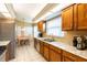 Bright kitchen features stainless steel appliances, tile floors, and a breakfast nook with a view at 2024 Glen Forge St, Brandon, FL 33511