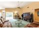 Cozy living room with a fireplace, media center, and a view of the backyard at 2024 Glen Forge St, Brandon, FL 33511