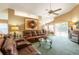 Bright living room featuring comfortable seating, fireplace, and access to the dining area at 2024 Glen Forge St, Brandon, FL 33511
