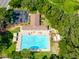 Aerial view showcasing the community pool with ample seating and a nearby parking area at 2024 Glen Forge St, Brandon, FL 33511