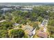 An aerial view showcases the property's location, surrounded by lush greenery and neighborhood amenities at 205 W 122Nd Ave, Tampa, FL 33612