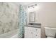 Bathroom with tub, marble tile, and modern vanity at 205 W 122Nd Ave, Tampa, FL 33612
