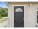Exterior shot of the entrance door with a white door frame at 205 W 122Nd Ave, Tampa, FL 33612