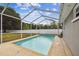 Backyard with screened in pool and fenced yard at 205 W 122Nd Ave, Tampa, FL 33612