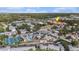 Panoramic aerial view of the resort’s extensive amenities, tennis courts, lush surroundings, and nearby roads at 21007 Sunpoint Way # 203, Lutz, FL 33558