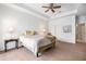 Bright bedroom with wood floors, a ceiling fan and double door closet at 21007 Sunpoint Way # 203, Lutz, FL 33558