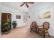 Comfortable living room with ceiling fan, traditional-style furnishings and neutral color palette at 21007 Sunpoint Way # 203, Lutz, FL 33558
