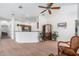 Inviting living room with a breakfast bar that connects to the kitchen, perfect for entertaining at 21007 Sunpoint Way # 203, Lutz, FL 33558