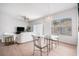 Bright living room with white furniture, wood floors, and lots of natural light at 21007 Sunpoint Way # 203, Lutz, FL 33558