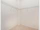 This walk-in closet includes wire shelving, neutral paint, and tile flooring at 21007 Sunpoint Way # 203, Lutz, FL 33558