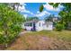 Charming single story home with mature landscaping and a cozy front porch at 215 35Th Ne Ave, St Petersburg, FL 33704