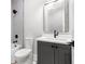 Modern bathroom with a large vanity, toilet, and shower with black hardware at 218 Hesperides N St, Tampa, FL 33609