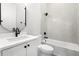 Modern bathroom with white subway tile, black hardware, and elegant fixtures at 218 Hesperides N St, Tampa, FL 33609