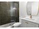 Bathroom with olive subway tile shower, marble vanity, and gold hardware at 218 Hesperides N St, Tampa, FL 33609