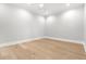 Bedroom featuring light hardwood floors, neutral walls, and ceiling fan at 218 Hesperides N St, Tampa, FL 33609