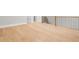 Upstairs bonus room area features wood floors and trim, and a railing with black spindles at 218 Hesperides N St, Tampa, FL 33609