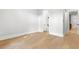 Bedroom showcasing hardwood floors, with a bathroom entrance and closet at 218 Hesperides N St, Tampa, FL 33609