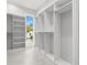 Large, empty closet features custom shelving and natural light through the window at 218 Hesperides N St, Tampa, FL 33609