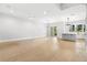 Open-concept floor plan with light hardwood floors, lots of natural light, and modern fixtures at 218 Hesperides N St, Tampa, FL 33609