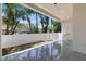 This covered patio features a modern design and overlooks the fenced in back yard at 218 Hesperides N St, Tampa, FL 33609