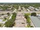 Aerial shot of a community with well-maintained homes, landscaping, and roadways with nearby commercial areas at 2216 Evans Rd, Clearwater, FL 33763