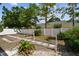 View of backyard featuring a statue, a privacy fence, offering a serene outdoor retreat at 2216 Evans Rd, Clearwater, FL 33763
