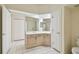 Bathroom boasts a large mirror, vanity, and tile flooring at 2216 Evans Rd, Clearwater, FL 33763