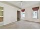 Bedroom features a carpeted floor, two windows, and closet access at 2216 Evans Rd, Clearwater, FL 33763
