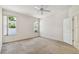 Carpeted bedroom with windows and a neutral color palette at 2216 Evans Rd, Clearwater, FL 33763