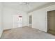 Bedroom featuring carpet floors with an ensuite bathroom and closet at 2216 Evans Rd, Clearwater, FL 33763