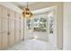 Breakfast nook features tiled floors, multiple windows, and a pendant light fixture at 2216 Evans Rd, Clearwater, FL 33763