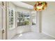 Breakfast nook features tiled floors, multiple windows, and a pendant light fixture at 2216 Evans Rd, Clearwater, FL 33763