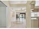 Bright entryway featuring tiled floors with views of the living area and kitchen at 2216 Evans Rd, Clearwater, FL 33763